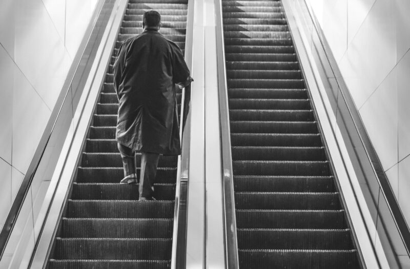 Walking Up Escalator Free Stock Photo